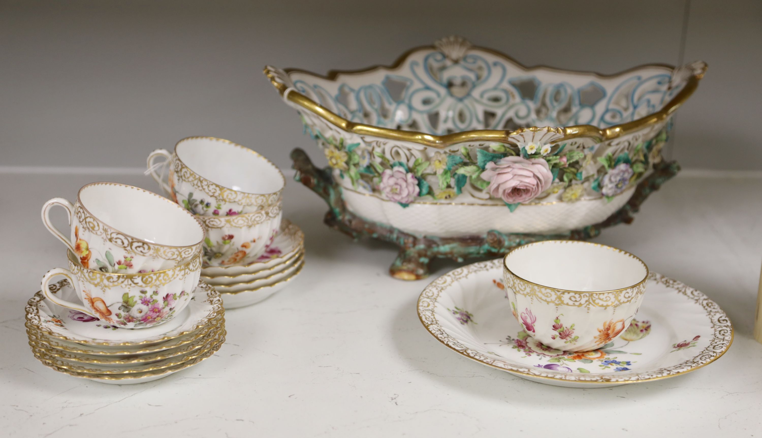 A Dresden-style pierced oval flower-encrusted bowl with branch feet and handles and a Dresden part tea service (15-pce)